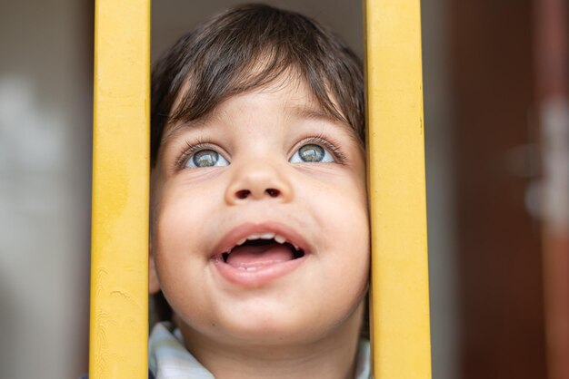 Baby boy with blue eyes looking