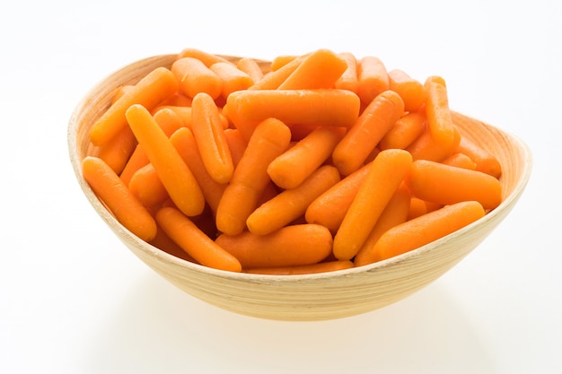 Baby carrot in wooden bowl