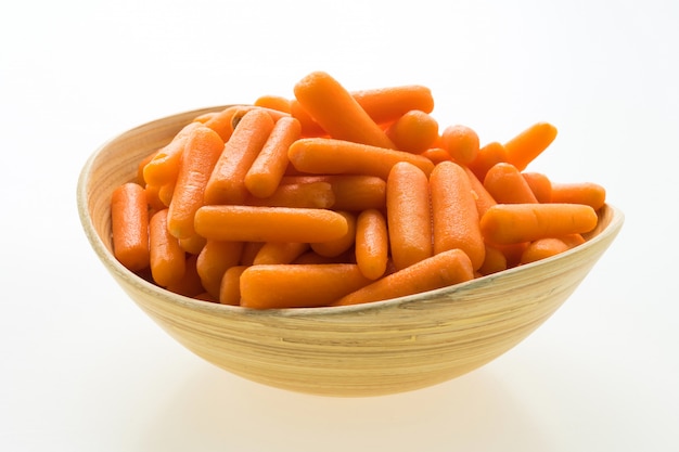 Baby carrot in wooden bowl