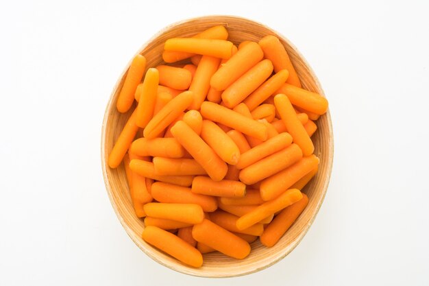 Baby carrot in wooden bowl