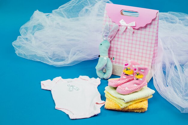 The baby clothes with a  gift box