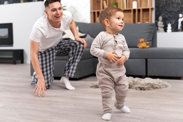 Free photo baby doing his first steps