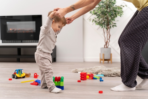 Free photo baby doing his first steps