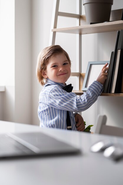 Baby dressed up as business person