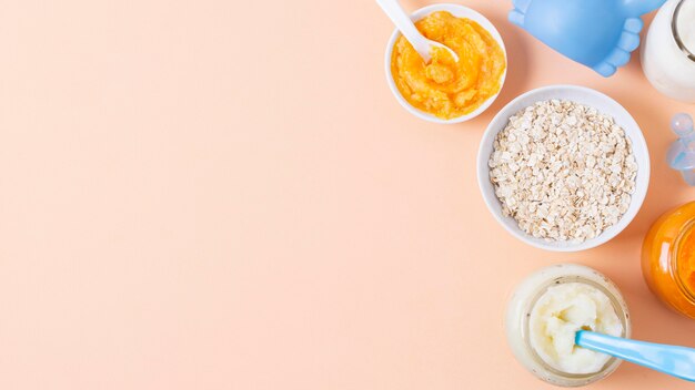 Baby food on pink background