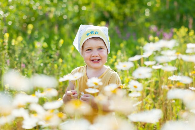 baby girl in daisy meadow