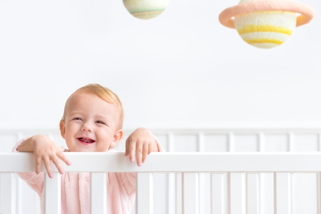 Baby girl in her crib