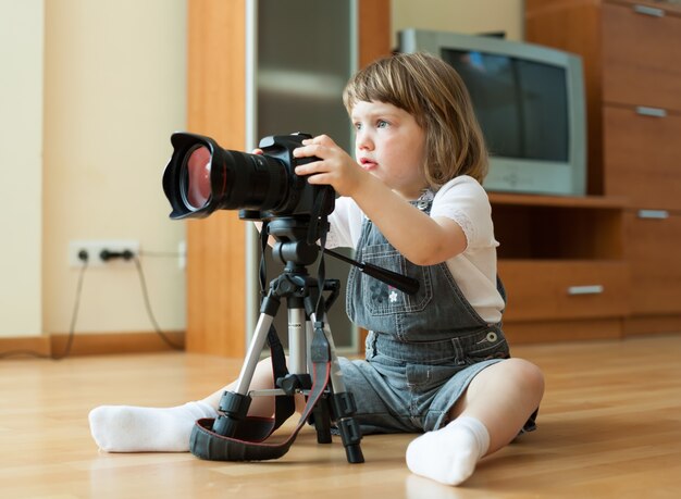 baby girl takes photo with camera