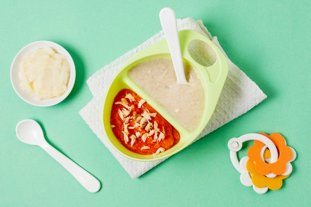 Baby homemade food on green background