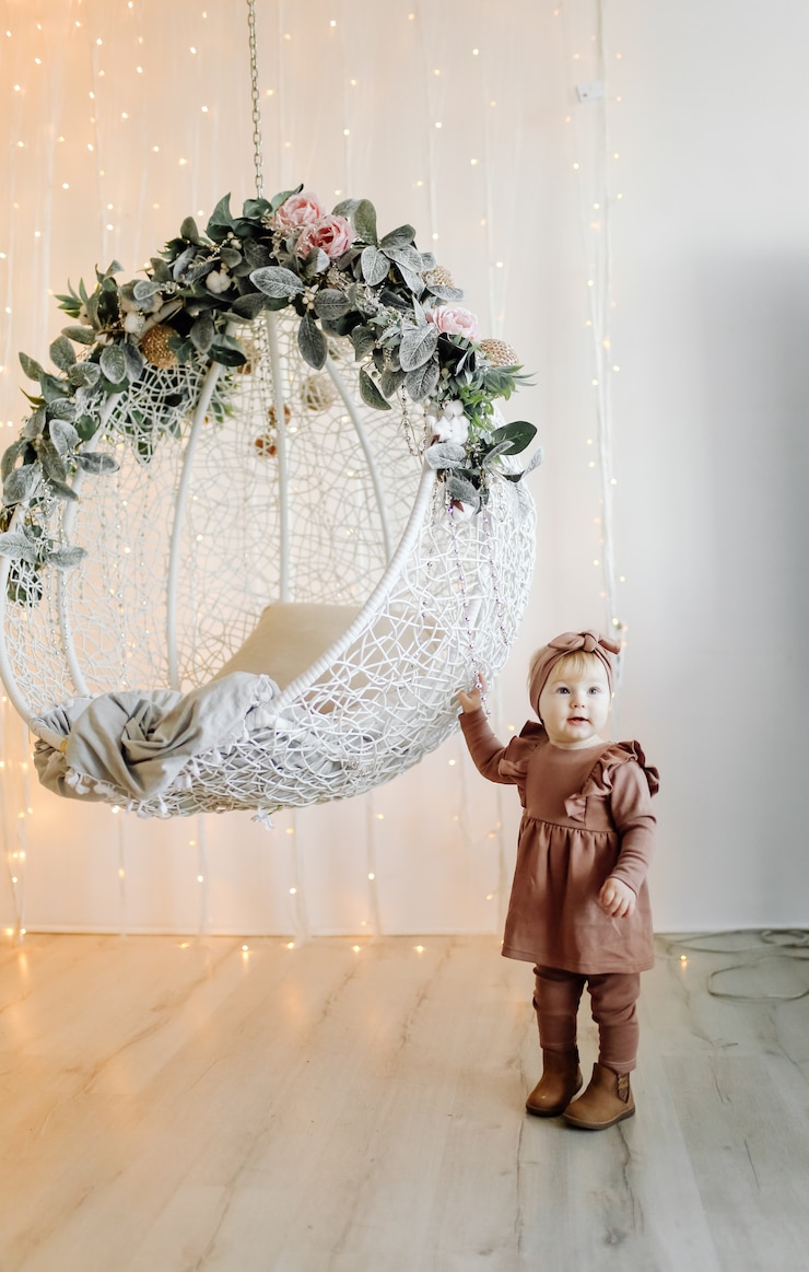 Free Photo baby posing in swing