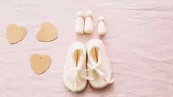 Free photo baby-shoes and paper hearts