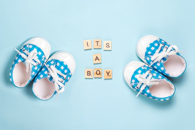 Baby shoes with "It's a boy" lettering
