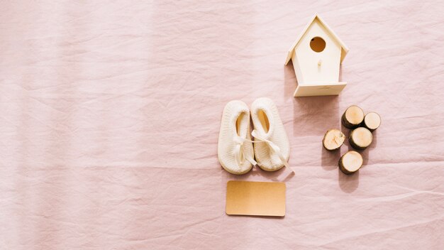 Baby-shoes and wooden decorations