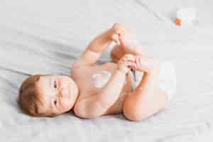 Free photo baby spread with lotion