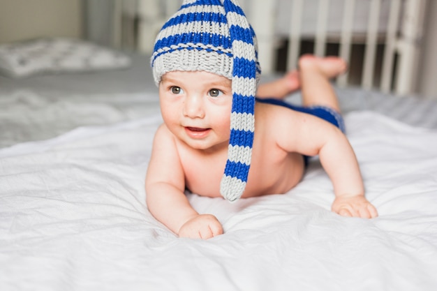 Baby wearing striped knitted hat