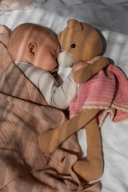 Free photo baby with stuffed animal