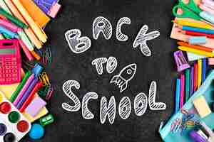 Free photo back to school background with school supplies on chalkboard