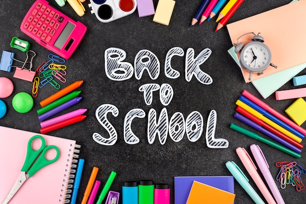 Free photo back to school background with school supplies and a clock