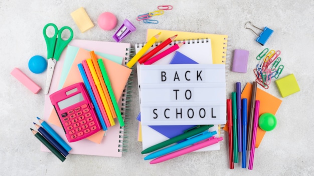 Back to school background with school supplies and light box