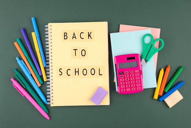 Back to school background with school supplies and notebook