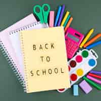 Free photo back to school background with school supplies and notebook