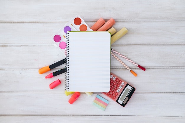 Free photo back to school composition with notepad and pens