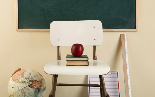 Back to school concept with apple on chair