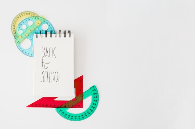 Free photo back to school decoration with notepad and set squares