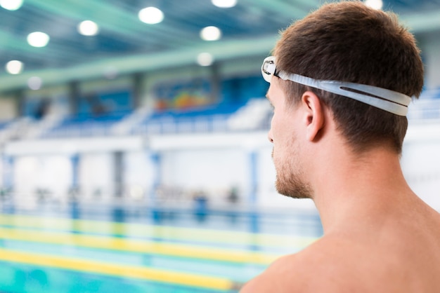 Back shot of focused swimmer