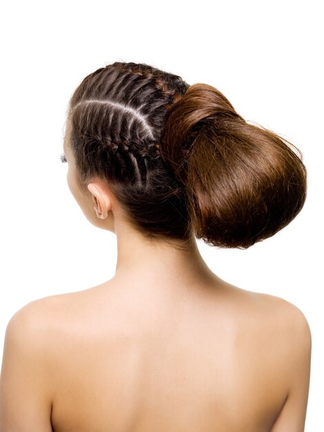 Back view of a beauty  hairstyle from pigtails.