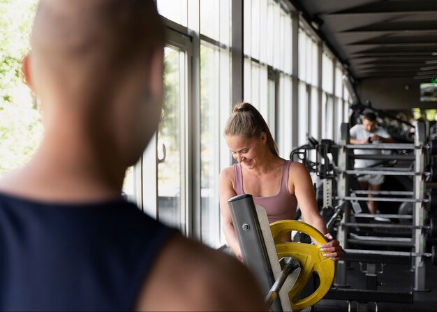 Free photo back view blurry man at gym