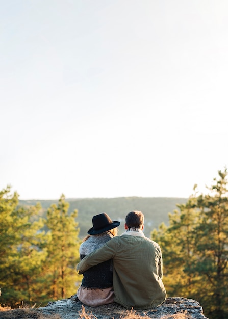 Free photo back view couple enjoying the nature