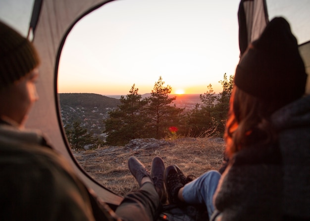 Back view couple enjoying sunrise