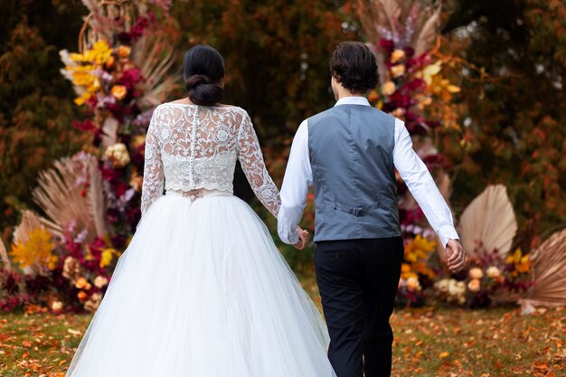 back view couple holding hands