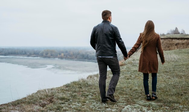 Back view of couple at the lake