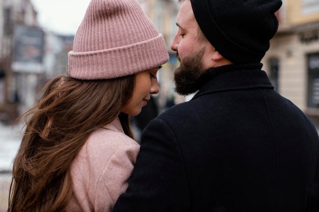 Free photo back view couple outdoor hugging