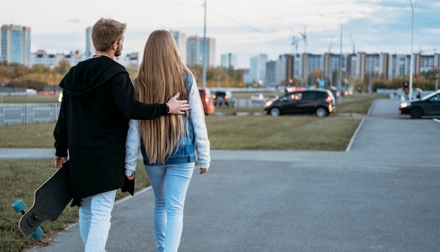 Back view of couple on a walk in the city