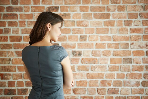 Back view of elegant woman looking to the side