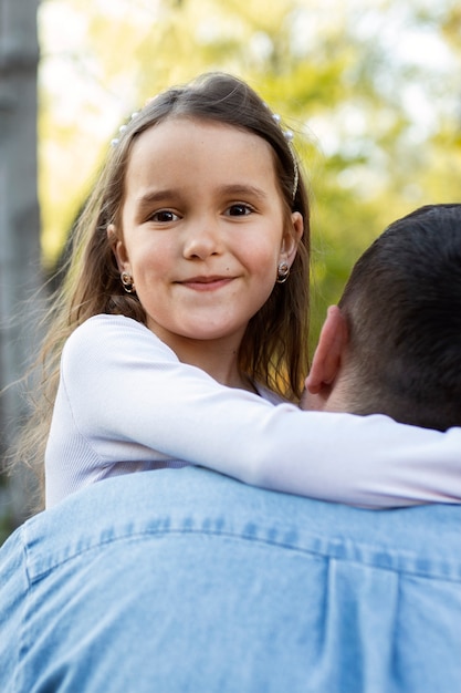 Free photo back view father holding girl