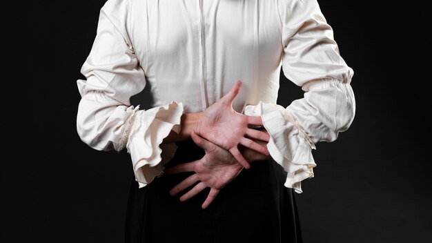 Back view flamenca dancer with hands crossed