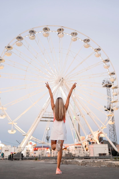 Back view girl at funfair