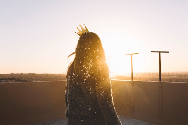 Back view girl on roof