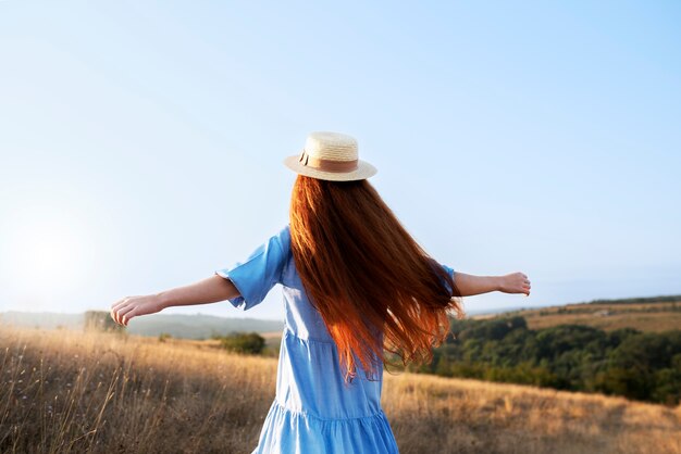 Back view girl wearing hat