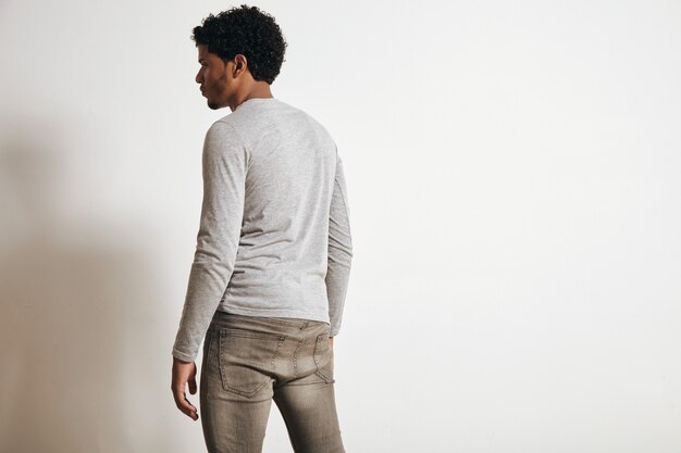 Back view of latino man looking on side, isolated on white, wearing blank heather grey clothing