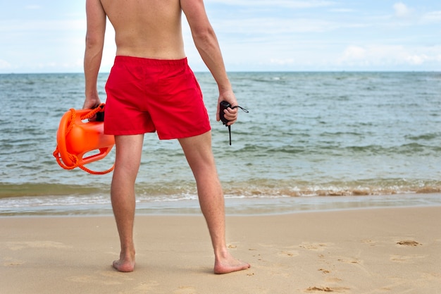 Back view lifeguard on beach