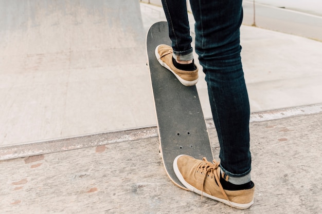 Free photo back view of man balancing on skateboard