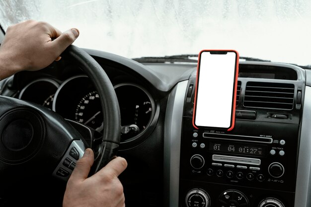 Back view of man driving the car for on a road trip