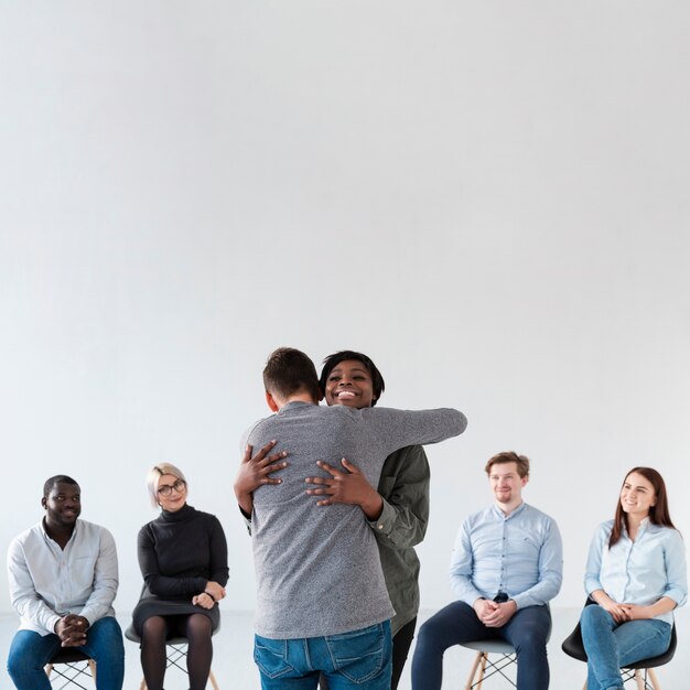 Back view man embracing smiling woman