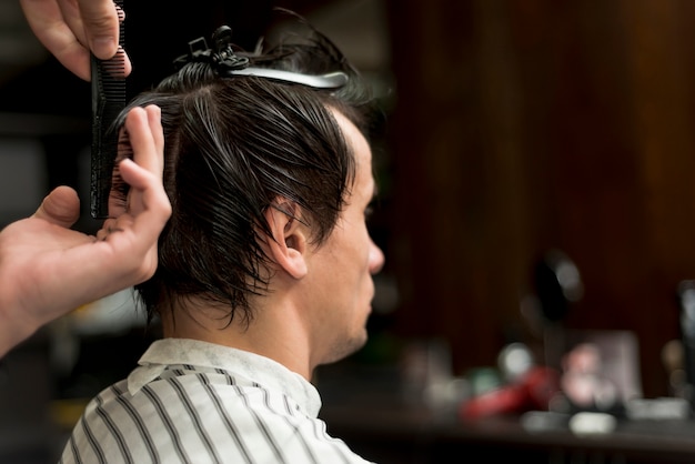 Back view of a man getting a haircut