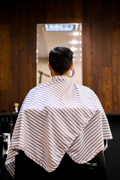 Back view of man at hair salon